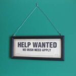 Help Wanted - Picture hanging on a wall asking for help